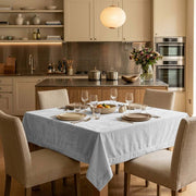Off-White Square Velvet Tablecloth in a Transitional Kitchen with Shaker Cabinets and Wood Island