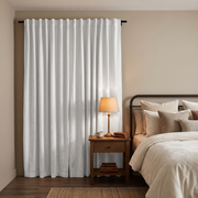 Off-White Velvet Back Tab Extra Long Curtains in a Cozy Bedroom with Dark Wood Furniture and Warm Table Lighting