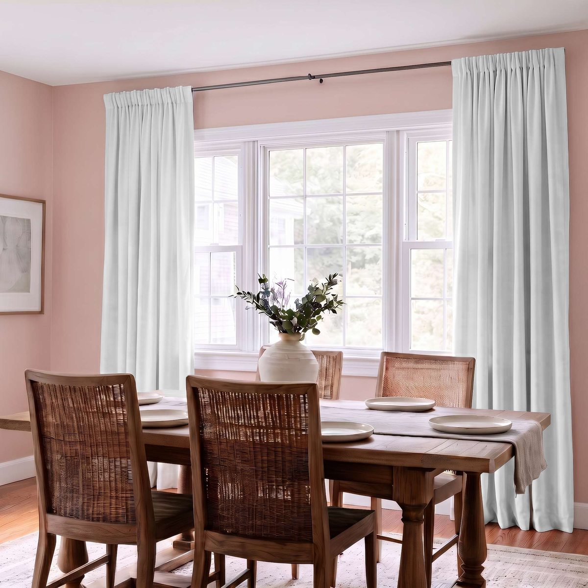 Off-White Velvet Curtains in a Light Dining Room with Pink Walls and a Wooden Table, Woven Wooden Chairs, White Plates