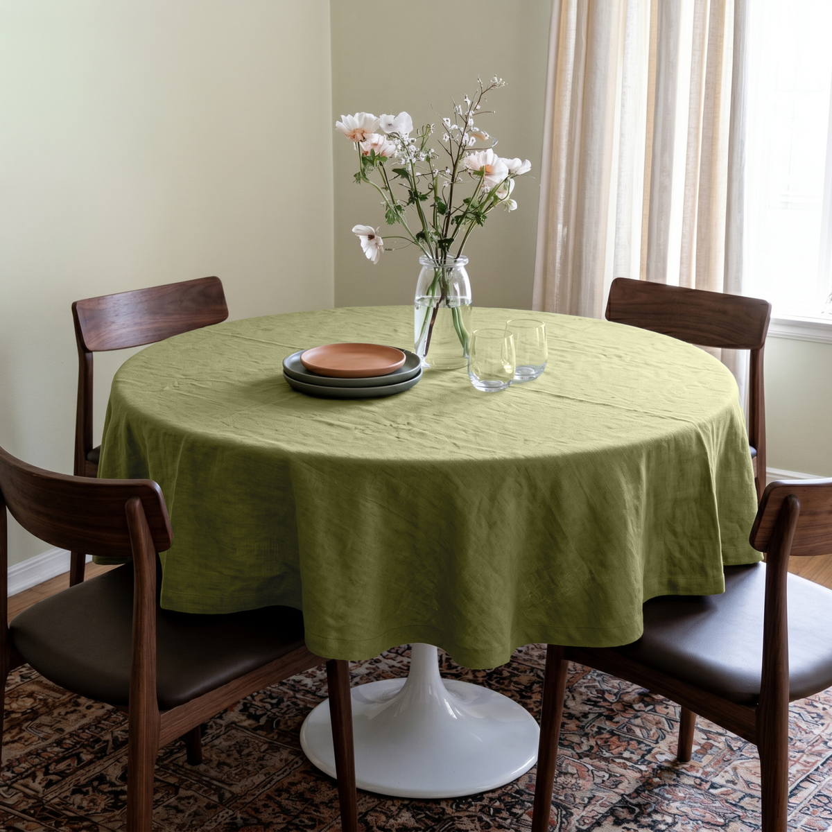 Olive Green Linen Round Tablecloth in a Cozy Dining Room with Pale Sage Walls and Walnut Wood, Dark Leather and Soft Neutral Accents