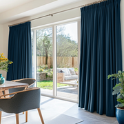 Peacock Blue Linen Pencil Pleat Curtains for Sliding Doors in a Dining Room with White Walls
@Heading: Pencil Pleat