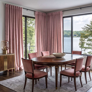 Pink Velvet Curtains in a Dining Room with White Walls and a Brown Table, Soft Pink Chairs
