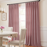 Pink Velvet Curtains in a Dining Room with Beige Walls, a White Dining Table, and a Rug