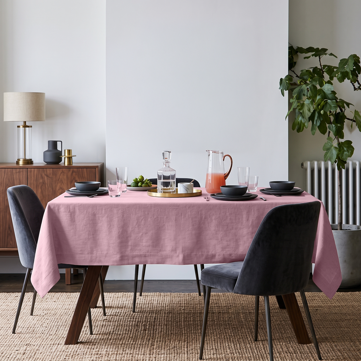 Dusty Rose Rectangular Linen Tablecloth in a Mid-Century Modern Dining Room with Walnut Furniture and Grey Upholstered Chairs