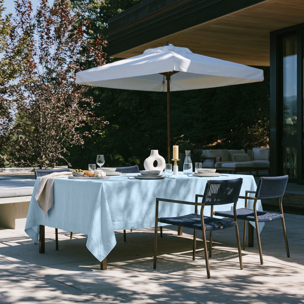 Sky Blue Rectangular Linen Tablecloth on a Modern Outdoor Patio