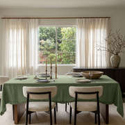 Asparagus Green Rectangular Linen Tablecloth in a Scandinavian Contemporary Dining Room with Sheer Curtains and Dark Wood Sideboard