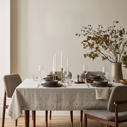 Natural Rectangular Linen Tablecloth in a Contemporary Dining Room with Walnut Chairs