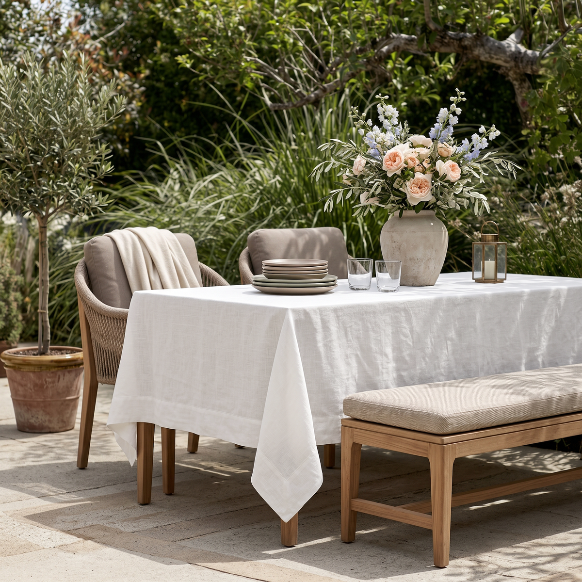 Off-White Rectangular Linen Tablecloth in a Mediterranean Outdoor Dining Area