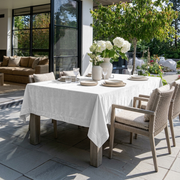 Off-White Rectangular Velvet Tablecloth in a Contemporary Patio Dining Area with Woven Chairs