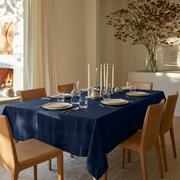 Royal Blue Rectangular Linen Tablecloth in a Contemporary Dining Room with Tan Leather Chairs