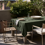 Sage Green Rectangular Linen Tablecloth on a Modern Outdoor Terrace with Woven Seating