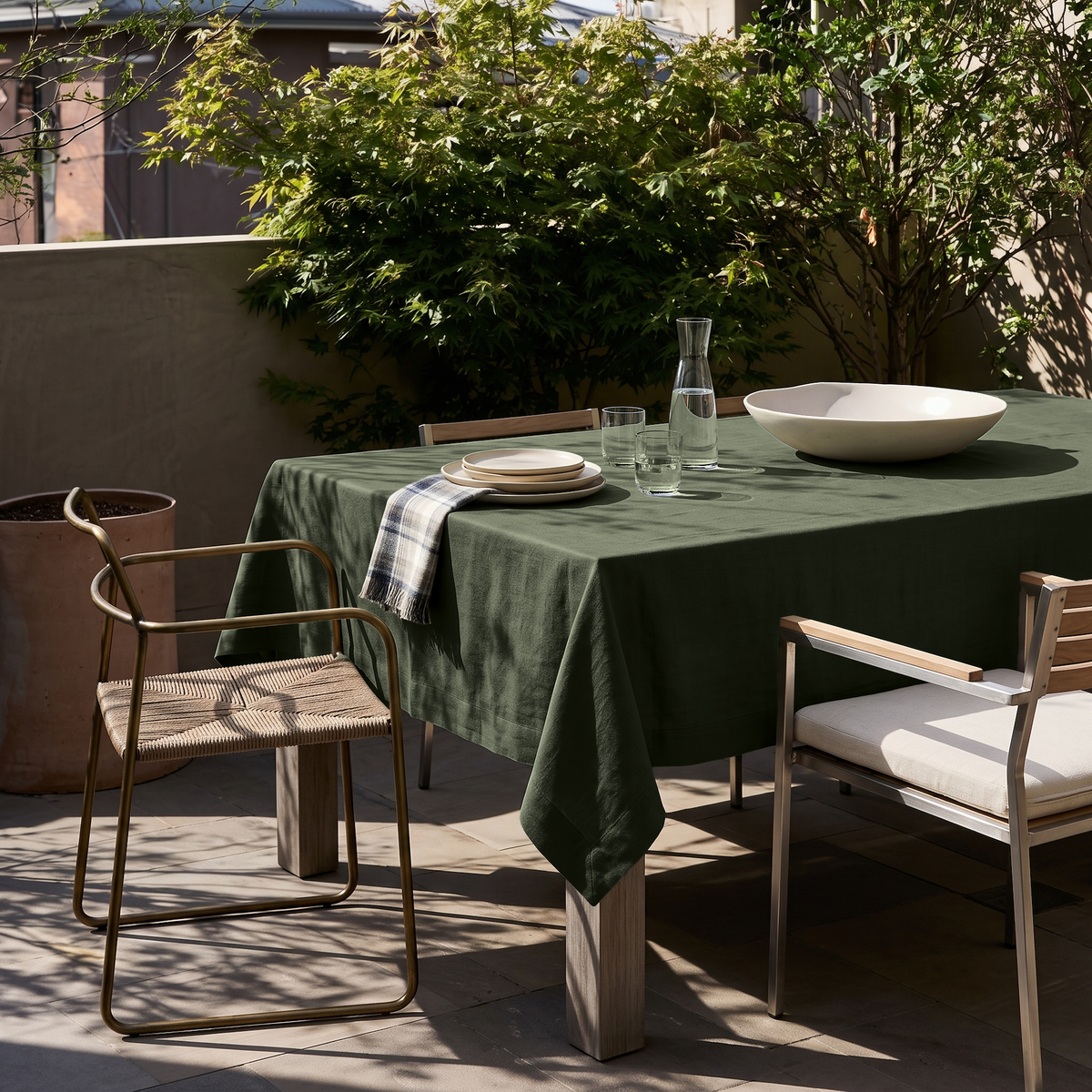 Sage Green Rectangular Linen Tablecloth on a Modern Outdoor Terrace with Woven Seating