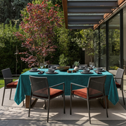 Teal Rectangular Velvet Tablecloth in a Contemporary Patio Dining Area with Black Woven Chairs