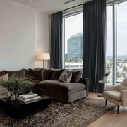 Steel Black Velvet Rod Pocket Curtains in a Contemporary High-Rise Living Room with a Sectional Sofa