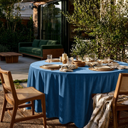 Steel Blue Velvet Round Tablecloth in an Outdoor Patio Dining Setting