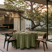 Olive Green Round Velvet Tablecloth in an Outdoor Dining Area with Walnut Chairs and Garden Views