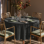 Dark Grey Round Velvet Tablecloth in an Elegant Dining Room with Brass Chairs and Olive Green Accents