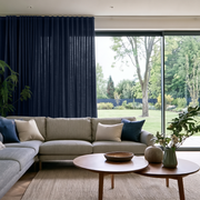 Royal Blue Linen S-Fold Extra Long Curtains in a Modern Living Room with Panoramic Windows and Light Beige Sectional Sofa