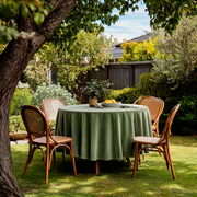Sage Green Velvet Round Tablecloth in a Garden Patio with Lush Greenery and Natural Rattan Chairs