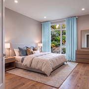 Sky Blue Linen Back Tab Extra Long Curtains in a Modern Bedroom with Natural Wood Furniture and Wood Flooring
