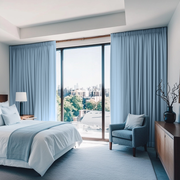 Sky Blue Linen Pencil Pleat Bedroom Curtains in an Airy Bedroom with White Walls and Soft Blue Accents