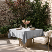 Stone Grey Square Linen Tablecloth on a Contemporary Garden Patio with Stone Walls