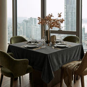 Dark Grey Square Velvet Tablecloth in a Modern Dining Room with City Views and Olive Green Chairs