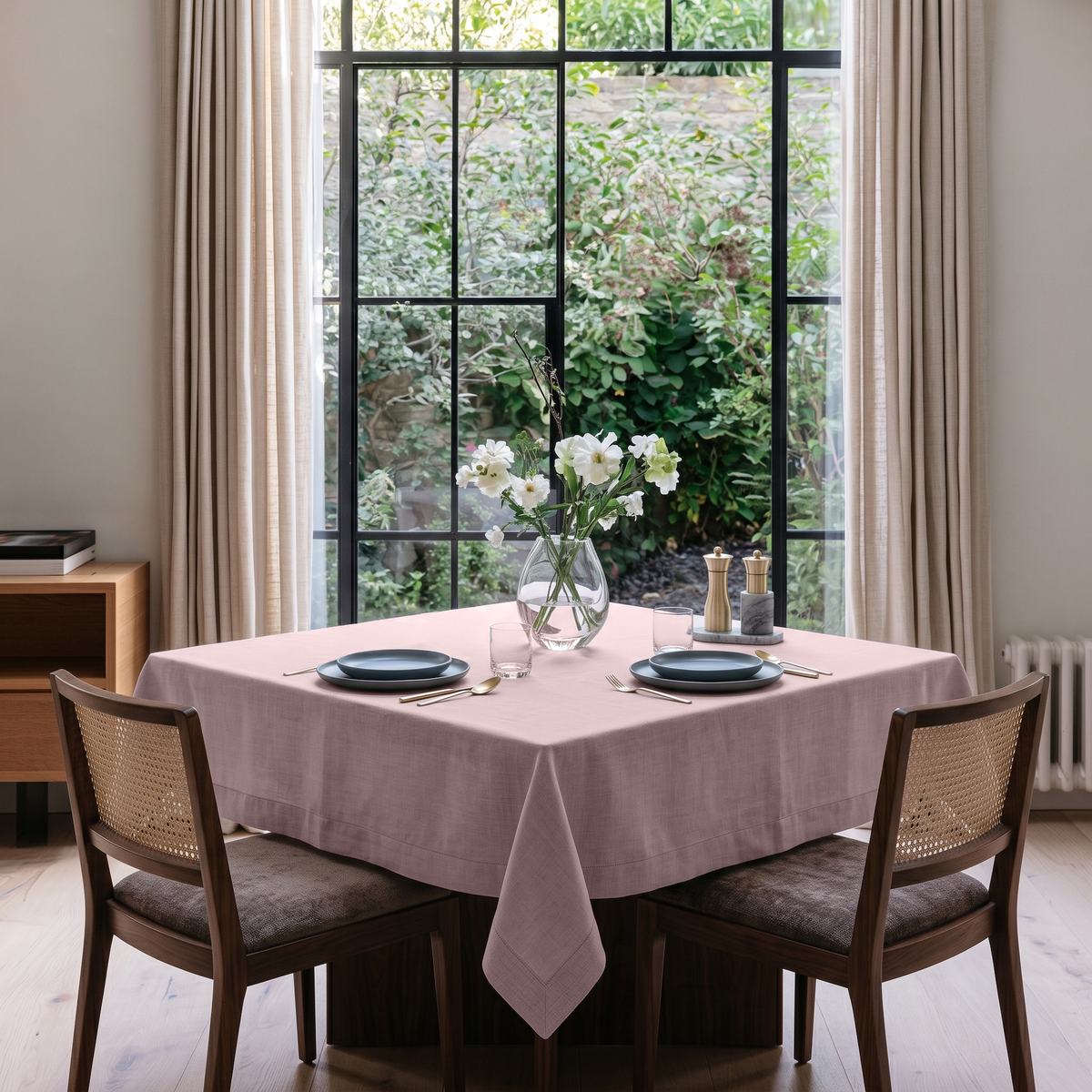 Dusty Pink Square Linen Tablecloth in a Transitional Dining Room with Cane Chairs