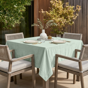Mint Green Square Velvet Tablecloth in a Modern Outdoor Dining Area with Woven Chairs