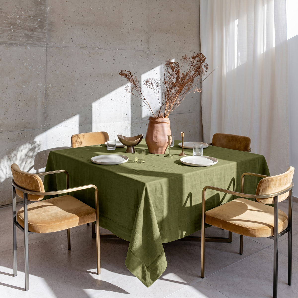 Olive Green Square Linen Tablecloth in a Contemporary Dining Room with Concrete Walls and Mustard Upholstered Chairs