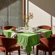 Light Green Square Velvet Tablecloth in a Modern Dining Room with Rust Upholstered Chairs