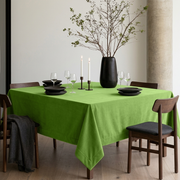 Light Green Square Velvet Tablecloth in a Minimalist Dining Room with Concrete Column and Black Tableware