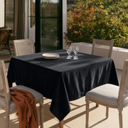 Steel Black Square Velvet Tablecloth in an Outdoor Dining Area with Cane Chairs