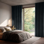 Steel Black Velvet Grommet Sliding Patio Door Curtains in a Modern Bedroom with Layered Dark Bedding