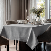 Stone Grey Rectangular Linen Tablecloth in a Contemporary Dining Room with Floor-to-Ceiling Curtains