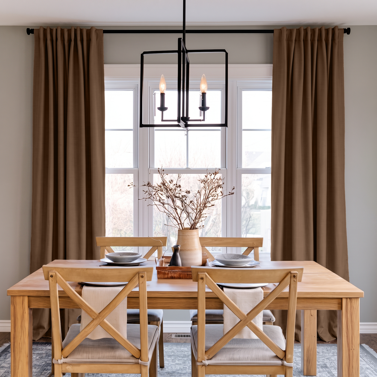 Tawny Brown Linen Back Tab Curtains in a Transitional Dining Room with Light Wood Furniture and Black Lantern Chandelier