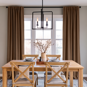 Tawny Brown Linen Back Tab Curtains in a Transitional Dining Room with Light Wood Furniture and Black Lantern Chandelier