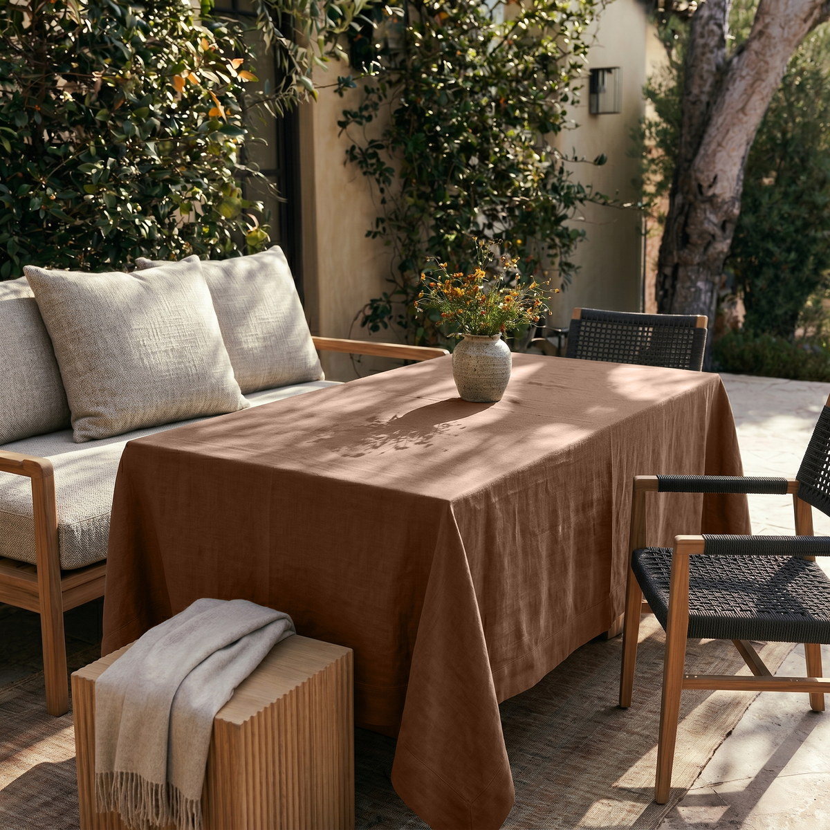 Tawny Brown Rectangular Linen Tablecloth in a Contemporary Outdoor Dining Area with Cushioned Seating