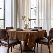 Tawny Brown Square Linen Tablecloth in a Contemporary Dining Room with Leather Chairs