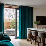 Teal Velvet Grommet Blackout Curtains for Sliding Doors in a Kitchen with Light Grey Walls