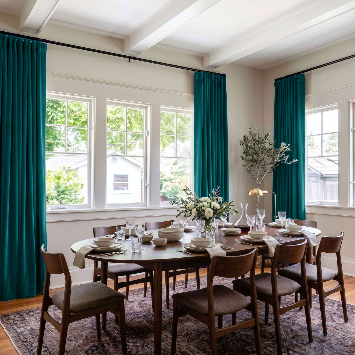Teal Velvet Curtains in a Spacious Dining Room with White Walls and a Large Brown Table, Soft Brown Chairs