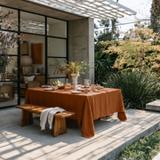 Terracotta Rectangular Heavy Weight Linen Tablecloth in a Contemporary Patio Dining Area with Wooden Bench Seating