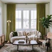 Moss Green Velvet Multitape Soundproof Curtains in a Living Room with a Cream Sofa
