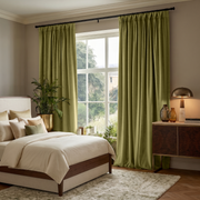 Moss Green Velvet Pinch Pleat Curtains in a Modern Bedroom with White Bedding and a Walnut Cabinet