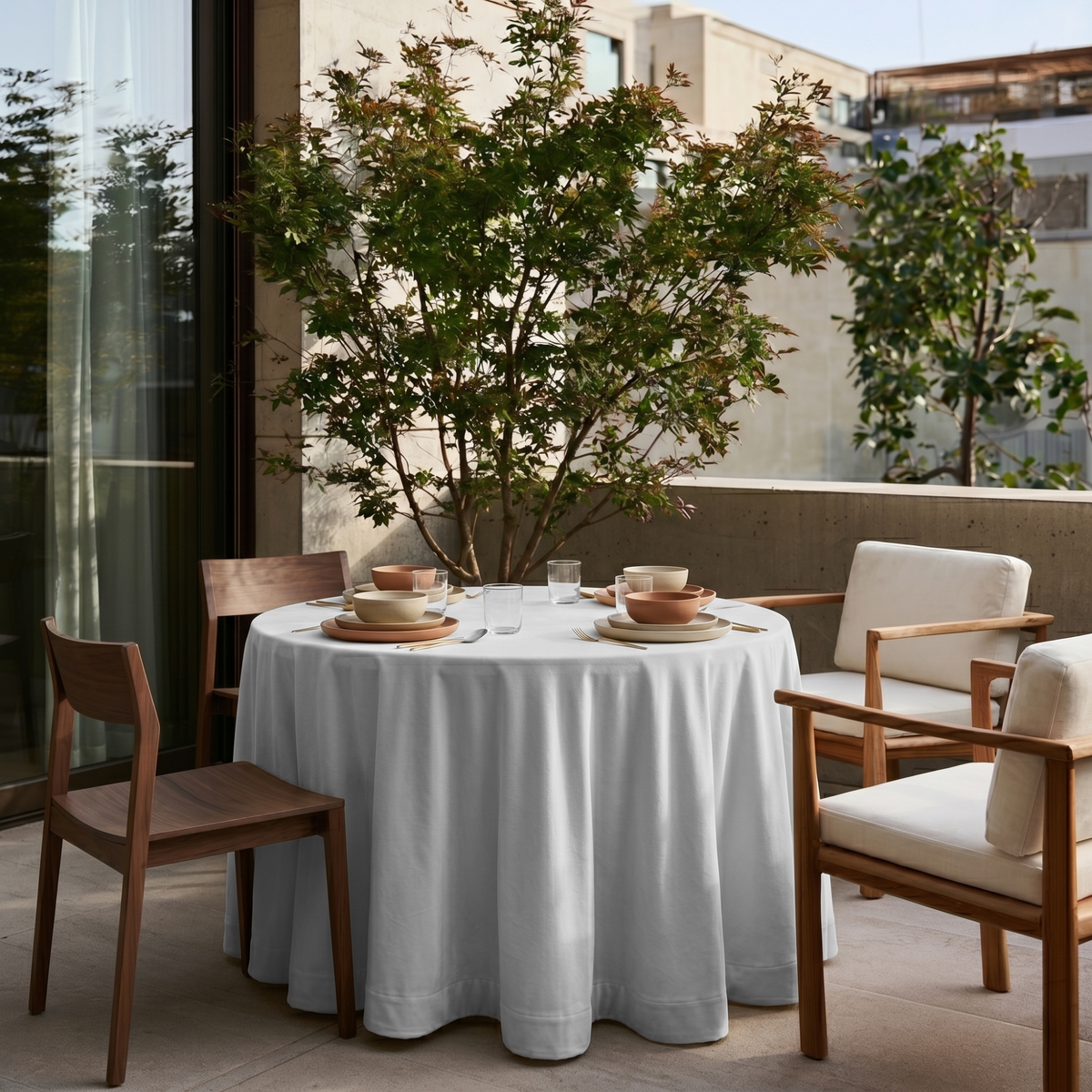 Off-White Velvet Round Tablecloth in a Sunlit Patio with White Upholstery