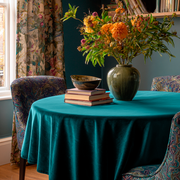 Teal Velvet Round Tablecloth in a Moody Dining Room with Deep Teal Walls and Floral Textile