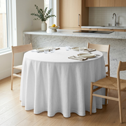 White Linen 108 Inch Round Tablecloth in a Bright Kitchen Dining Space with Marble Countertops and Light Wood