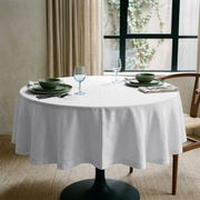 White Linen 42 Inch Round Tablecloth in a Cozy Dining Nook with Beige Walls and Olive Green Ceramic