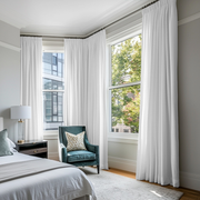 White Linen Pencil Pleat Bedroom Curtains in a Bright Classic Bedroom with Teal Velvet Chair and Powder Blue Accents - Cotton Lining