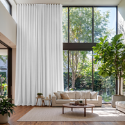 White Linen S-Fold Extra Long Curtains in a Modern Contemporary Living Room with Double-Height Windows
